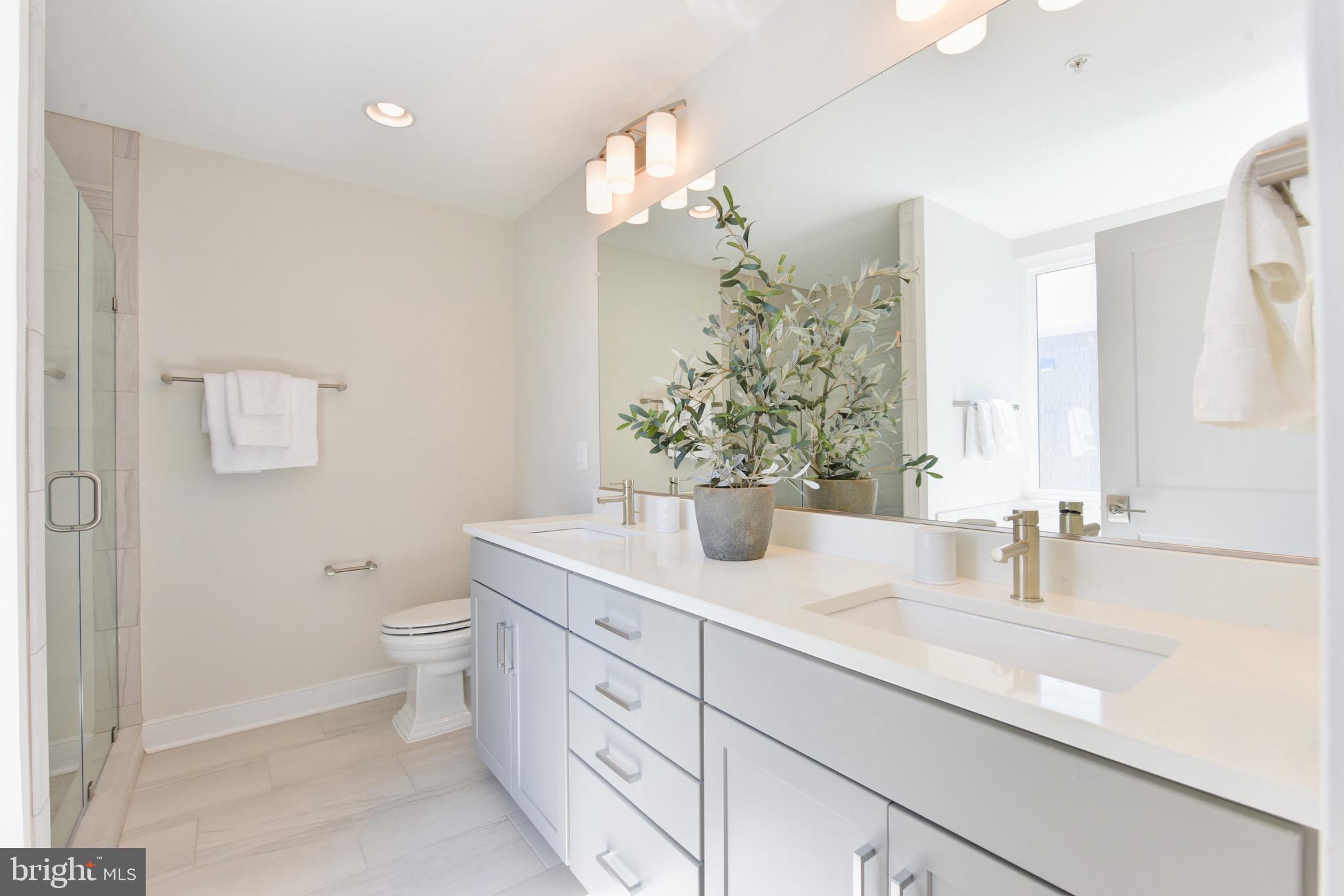 2815 24th Road South Arlington, VA 22206 - Photo 22 of 97 a bathroom with a toilet a sink and mirror