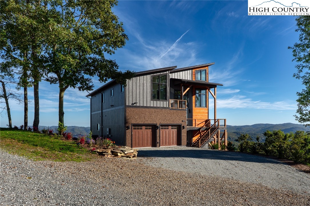 1180 Pinnacle Drive Boone, NC 28607 - Photo 46 of 50 a front view of a house with a yard