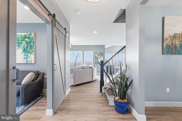 a view of a dining room with furniture wooden floor and a chandelier