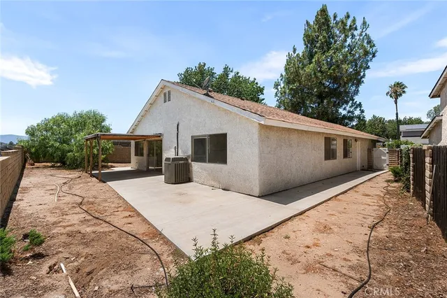 a view of a balcony with wooden fence