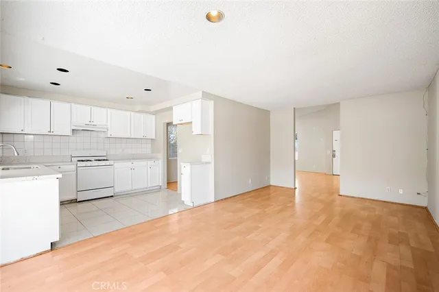 a view of a kitchen with a sink