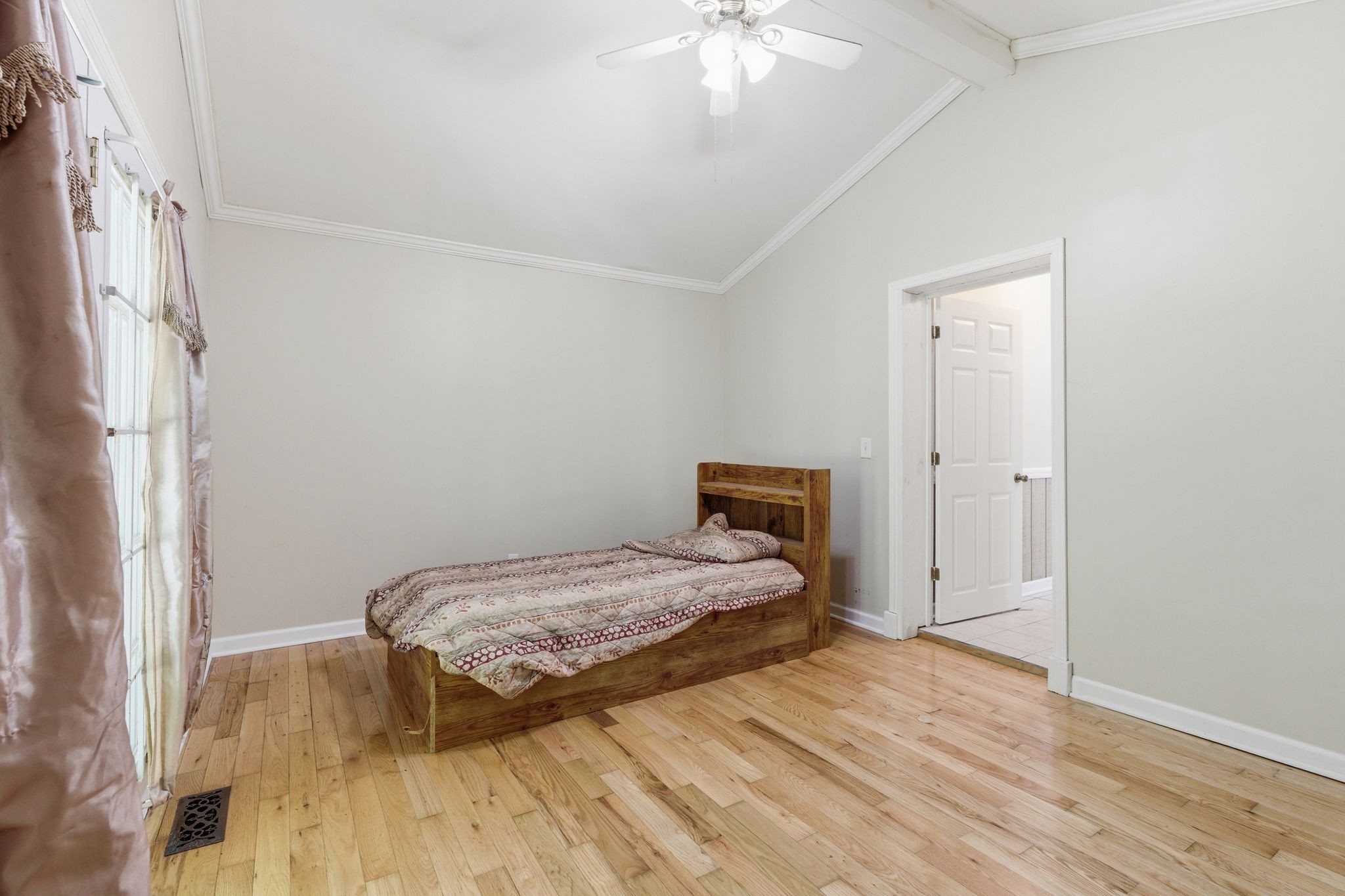 6603 Shedden Road Greenbrier, TN 37073 - Photo 13 of 30 a bedroom with a bed and a chandelier