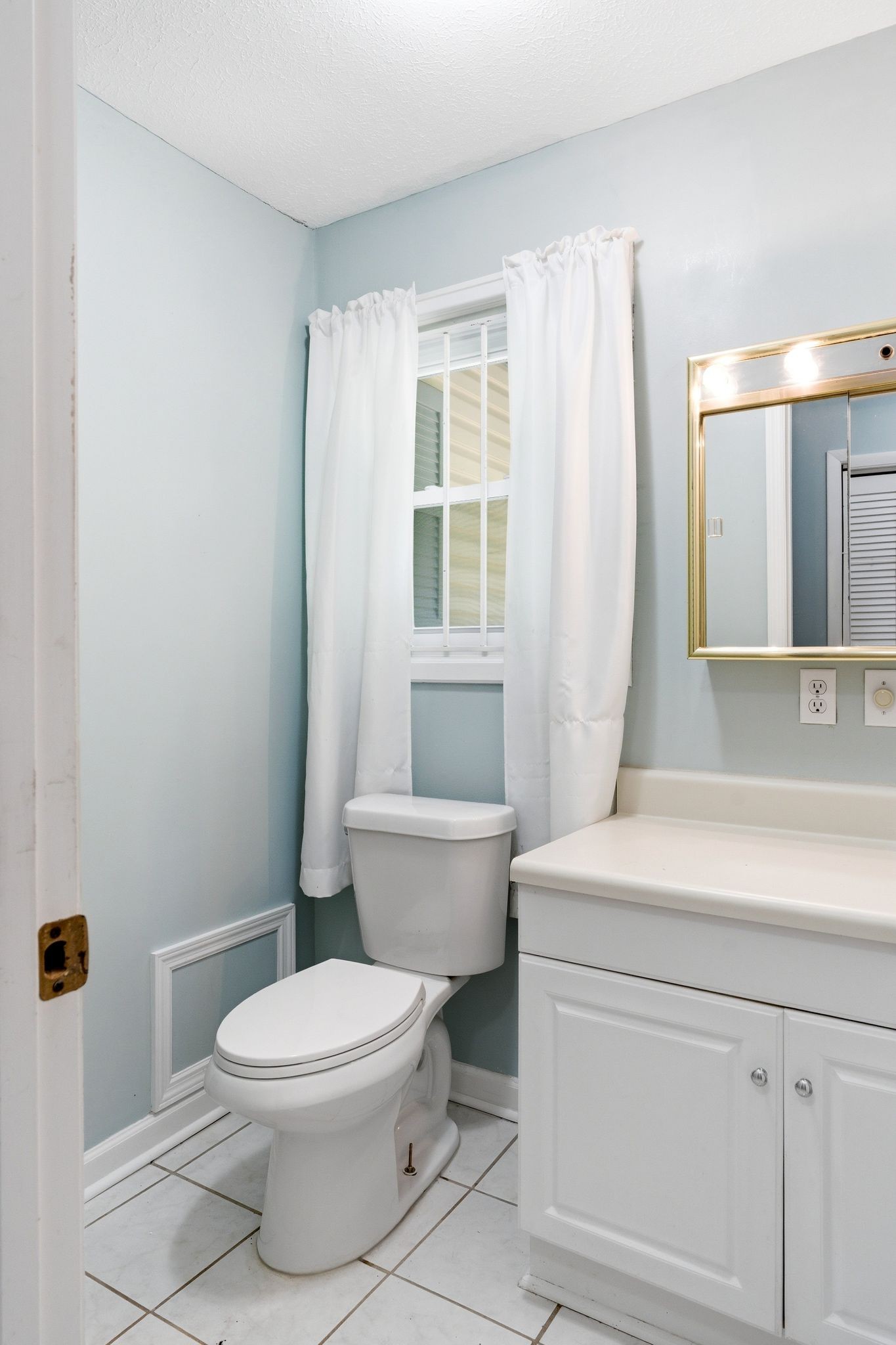 6603 Shedden Road Greenbrier, TN 37073 - Photo 17 of 30 a bathroom with a toilet a sink and a window