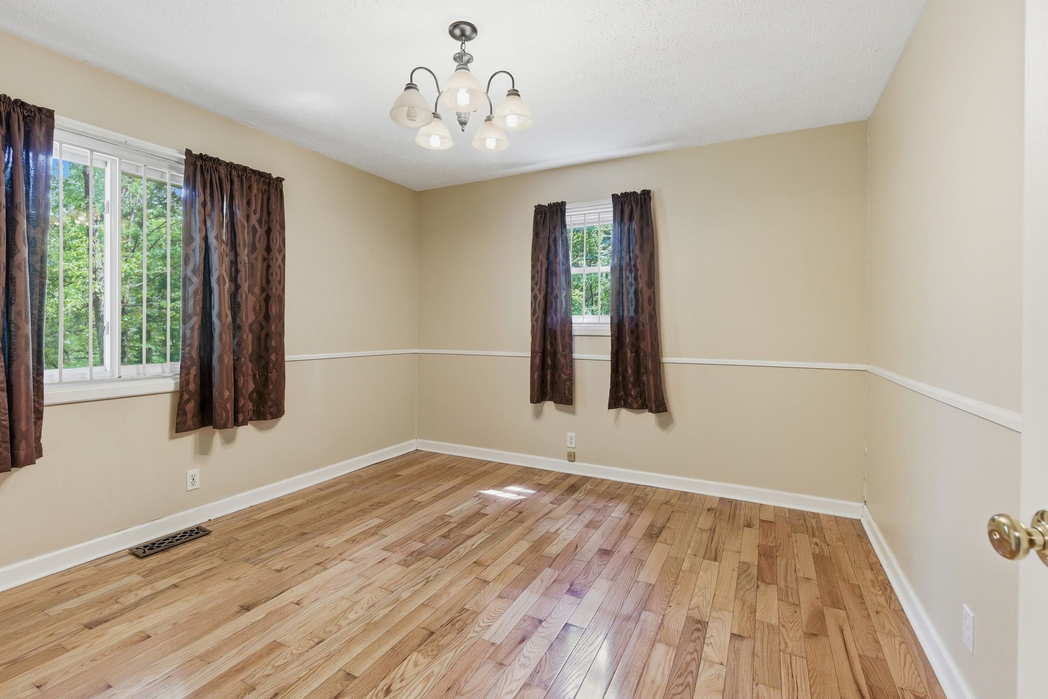6603 Shedden Road Greenbrier, TN 37073 - Photo 20 of 30 a view of an empty room with wooden floor and a window