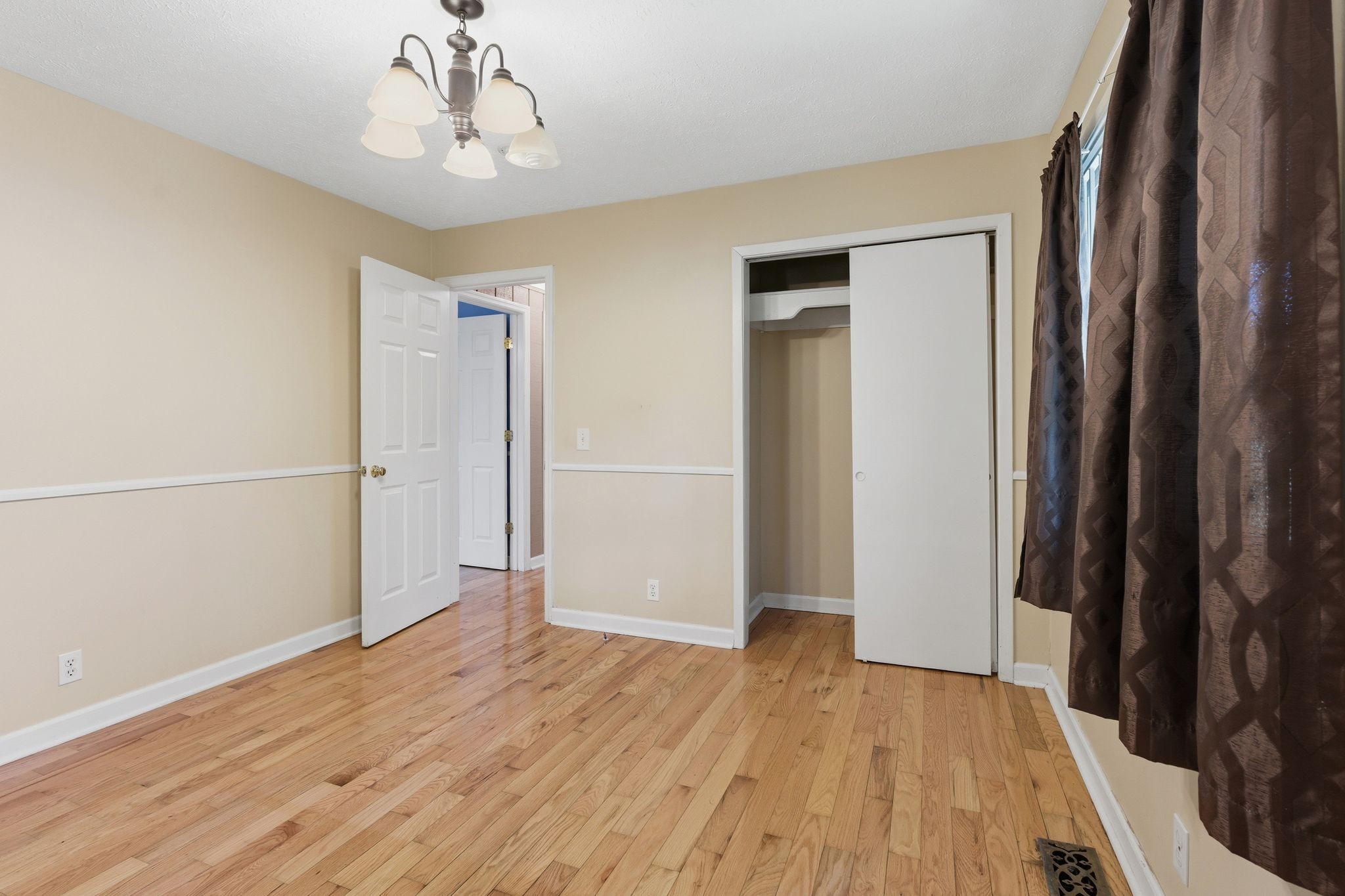 6603 Shedden Road Greenbrier, TN 37073 - Photo 21 of 30 wooden floor in an empty room with a window