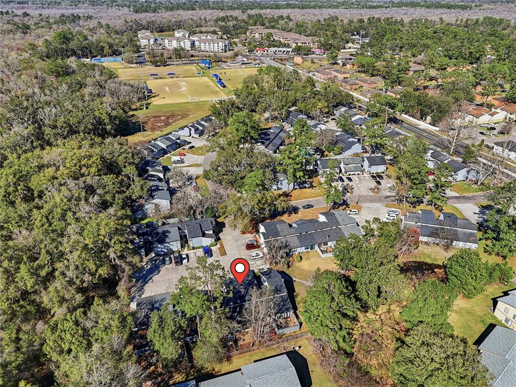 4427 Southwest 21st Lane Gainesville, FL 32607 - Photo 36 of 36 an aerial view of residential houses with outdoor space and trees