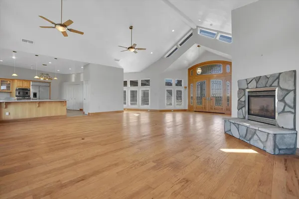 a kitchen with stainless steel appliances granite countertop a stove top oven a sink a counter space and cabinets