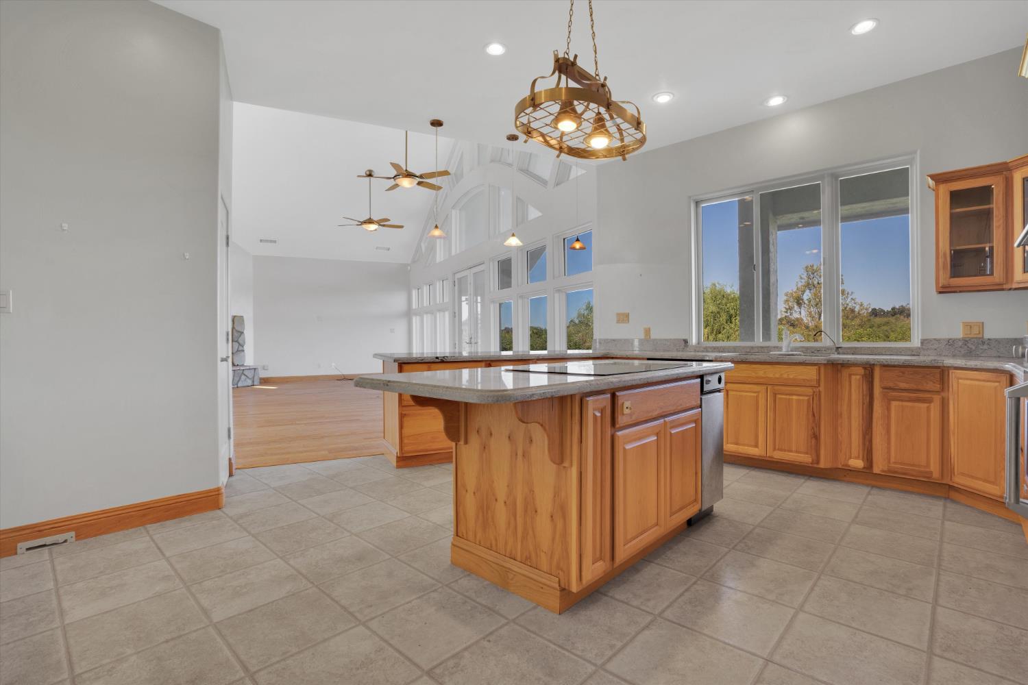 20170 River Road Stevinson, CA 95374 - Photo 15 of 77 a kitchen with a sink counter and cabinets
