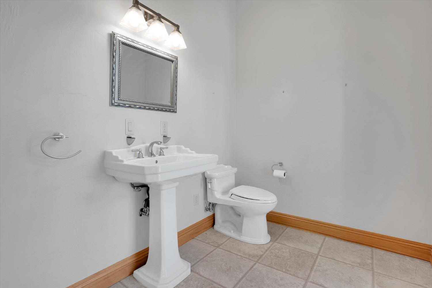 20170 River Road Stevinson, CA 95374 - Photo 27 of 77 a bathroom with a sink toilet and mirror