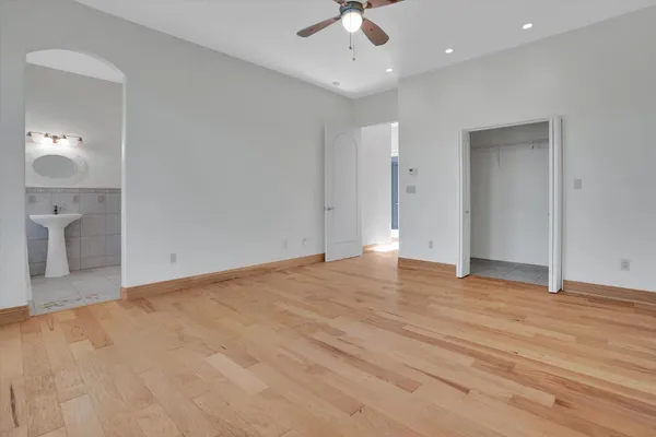 a living room with fireplace furniture and a wooden floor