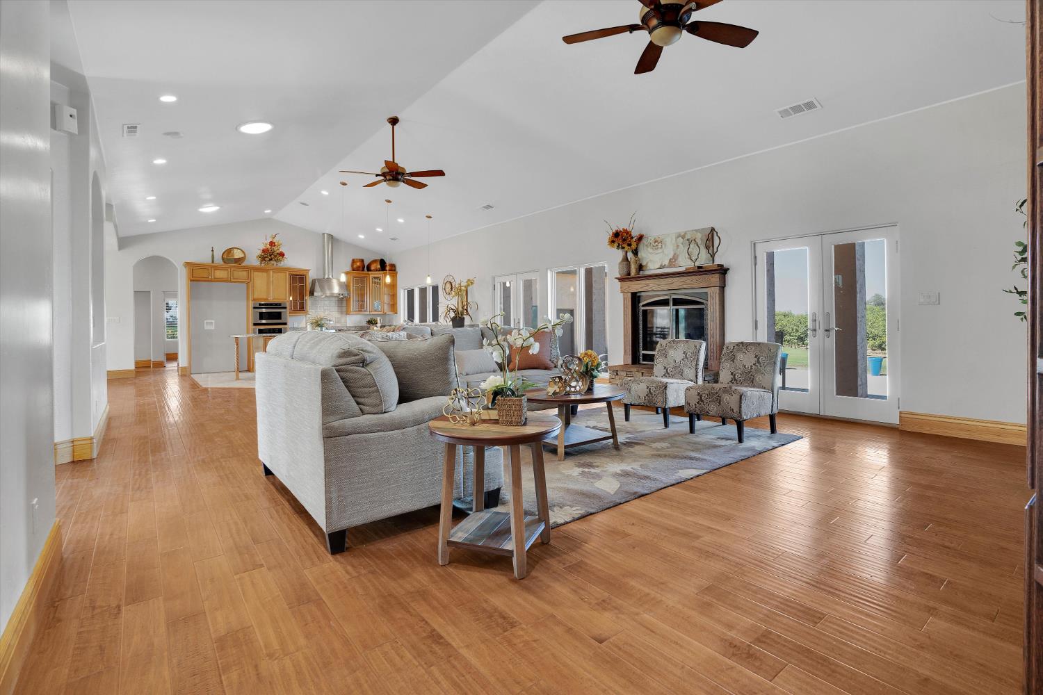 20170 River Road Stevinson, CA 95374 - Photo 45 of 77 a living room with fireplace furniture and a wooden floor