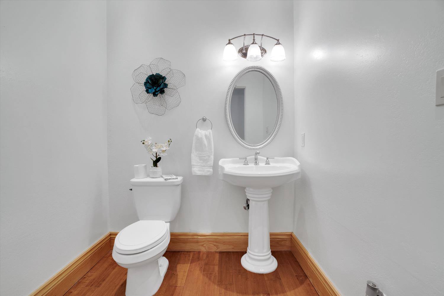 20170 River Road Stevinson, CA 95374 - Photo 55 of 77 a bathroom with a toilet sink and mirror