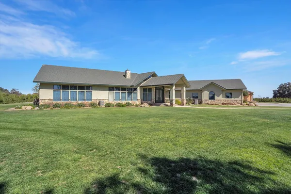a front view of a house with a yard