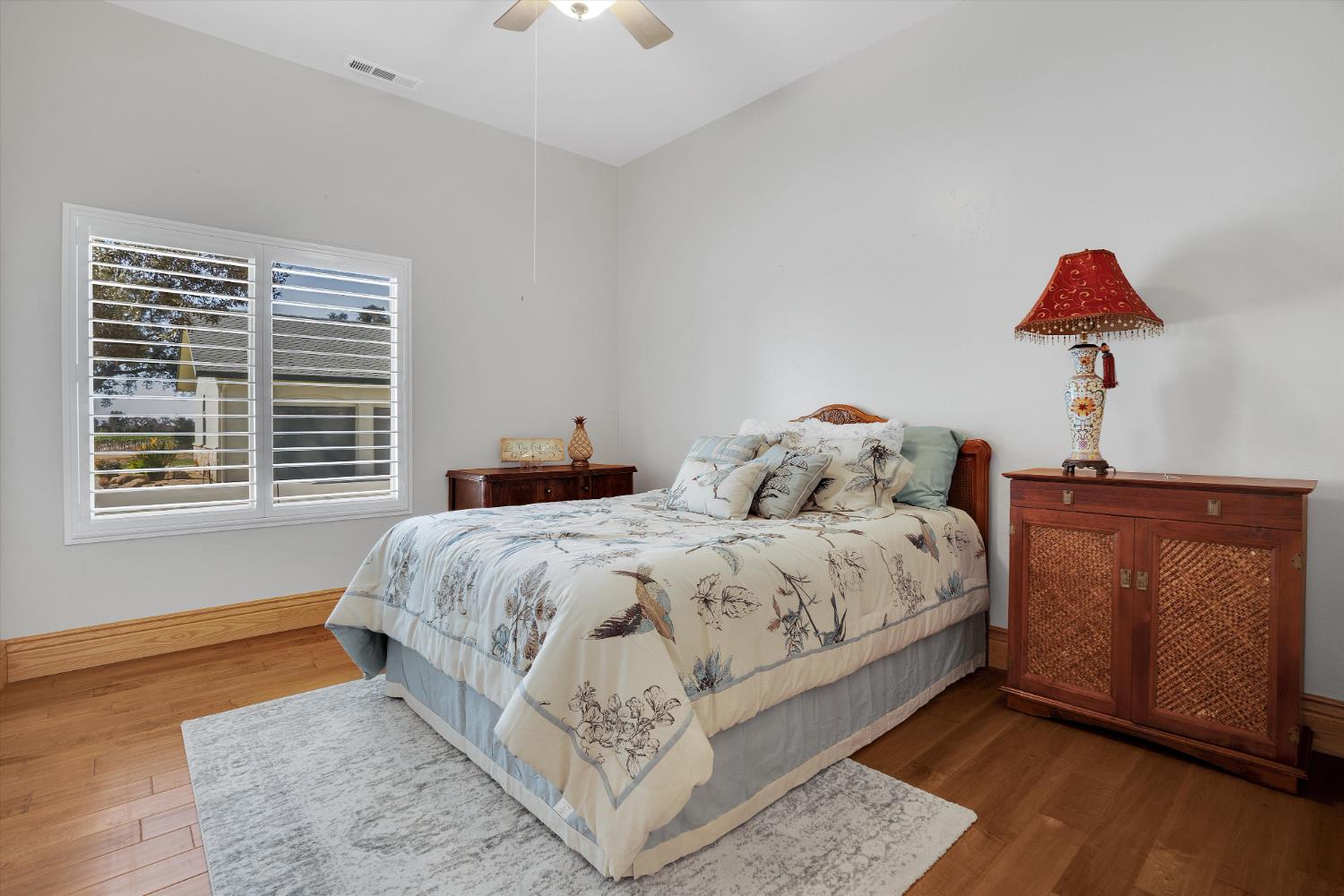 20170 River Road Stevinson, CA 95374 - Photo 64 of 77 a bed sitting in a bedroom next to a window