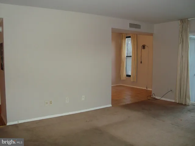 a kitchen with a stove and a refrigerator
