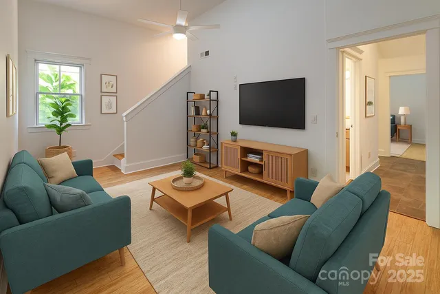 a living room with furniture and a flat screen tv
