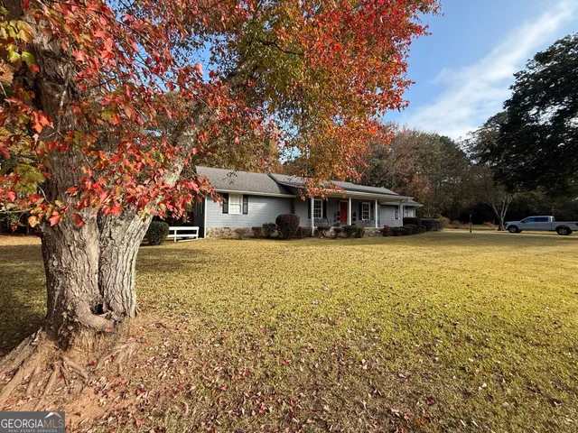 a house with trees in front of it