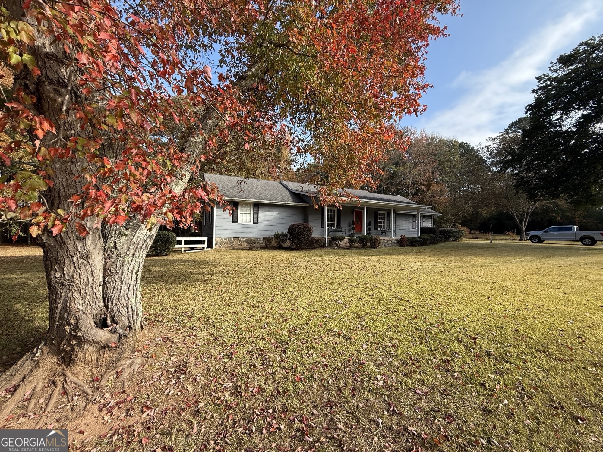 a house with trees in front of it