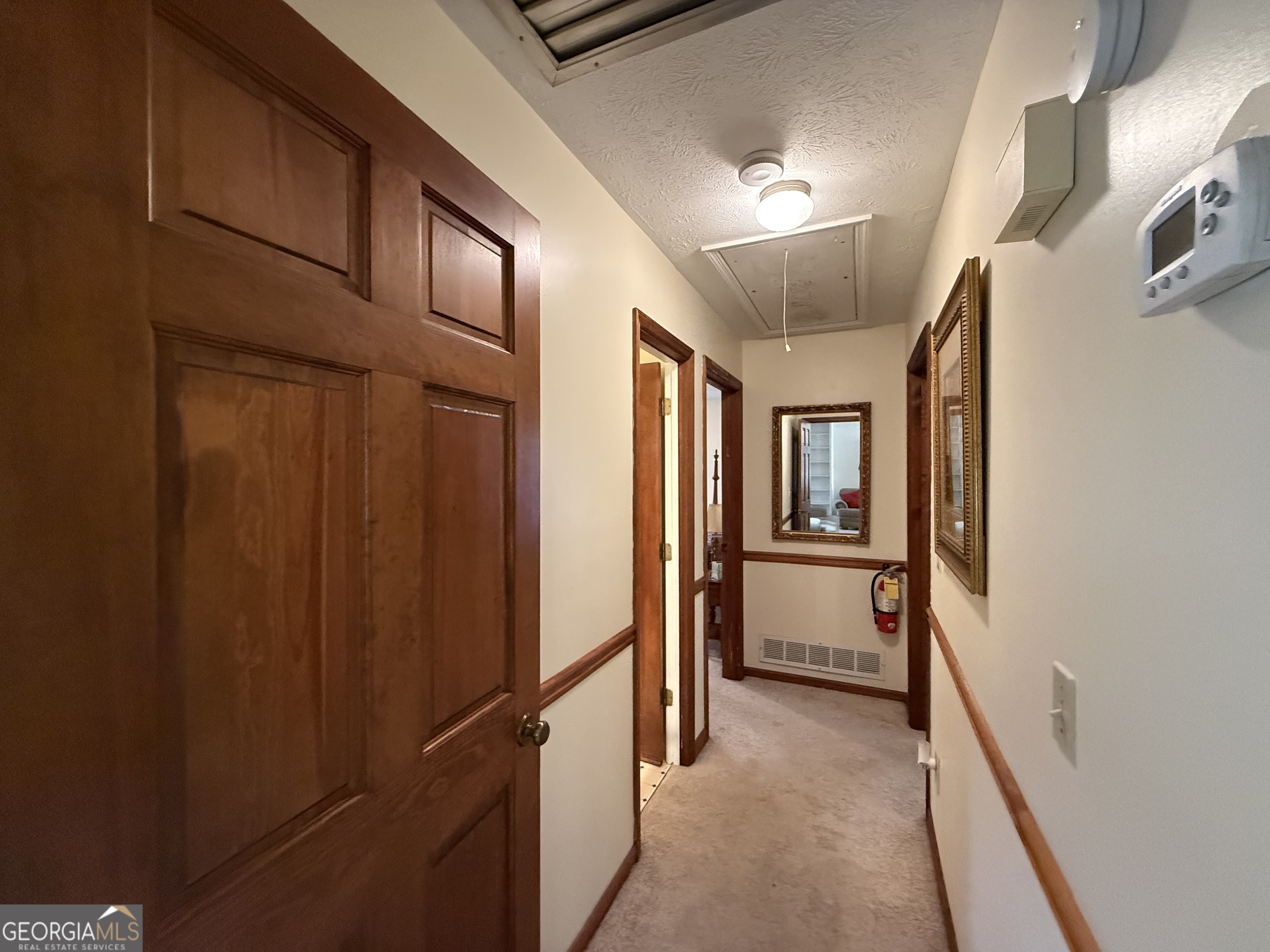 1084 Macedonia Road Newnan, GA 30263 - Photo 11 of 24 a view of hallway with chandelier