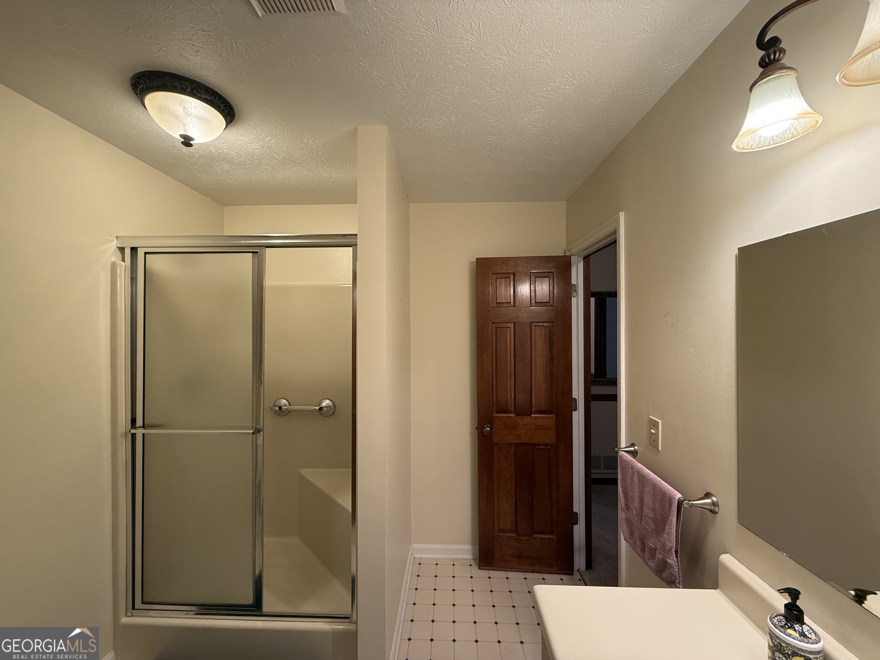 1084 Macedonia Road Newnan, GA 30263 - Photo 13 of 24 a bathroom with a shower