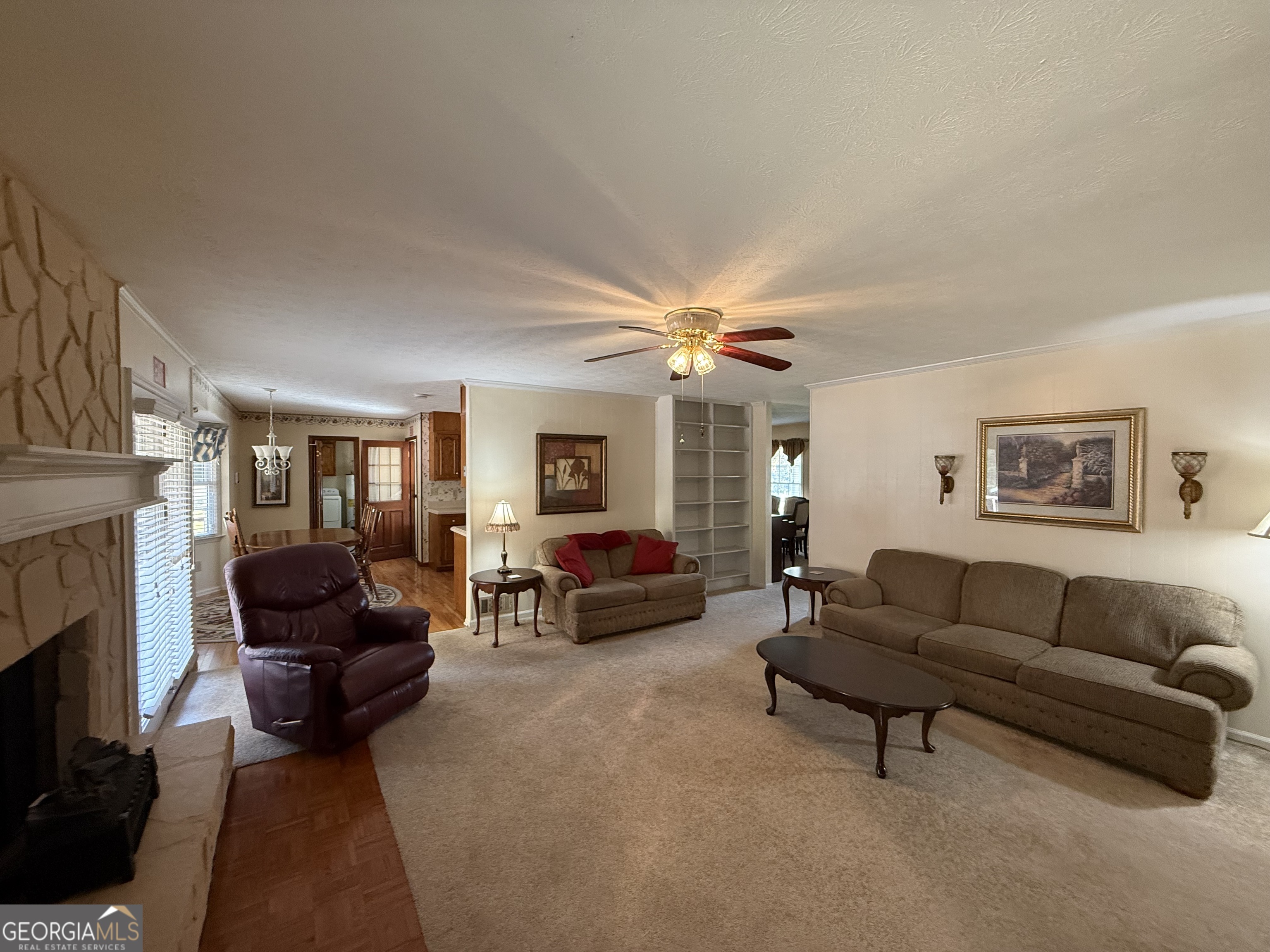 1084 Macedonia Road Newnan, GA 30263 - Photo 14 of 24 a living room with furniture and a fireplace