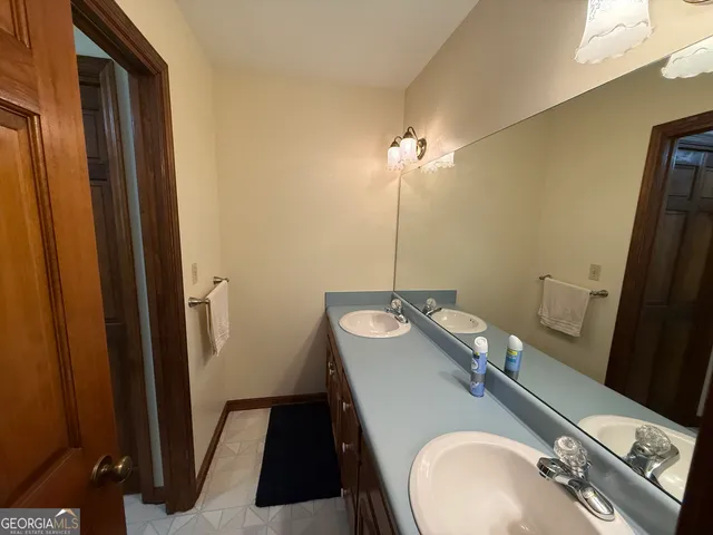 a bathroom with a sink and mirror