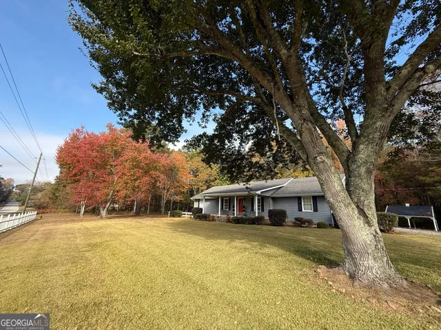 a front view of a house with a yard
