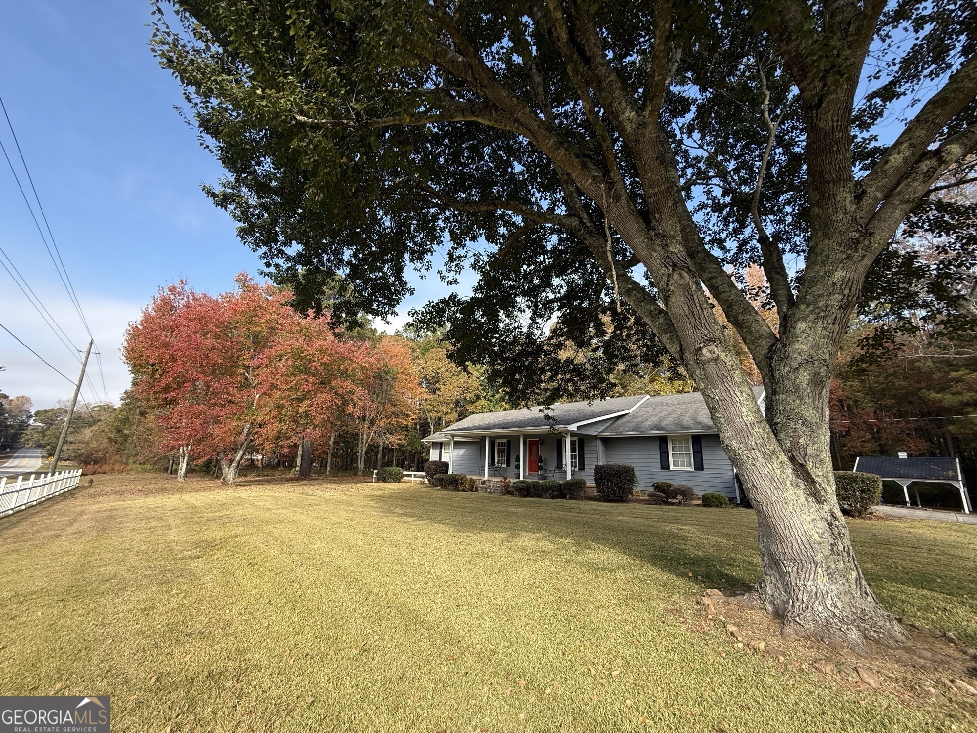 1084 Macedonia Road Newnan, GA 30263 - Photo 2 of 24 a front view of a house with a yard