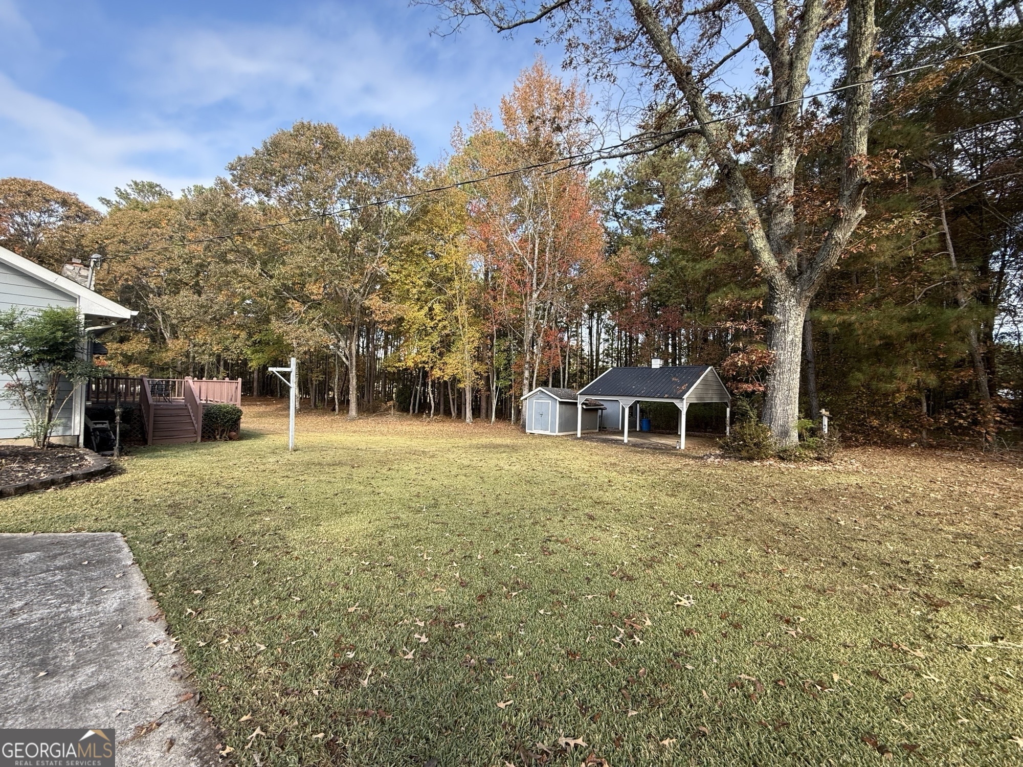 1084 Macedonia Road Newnan, GA 30263 - Photo 22 of 24 a front view of a house with a garden