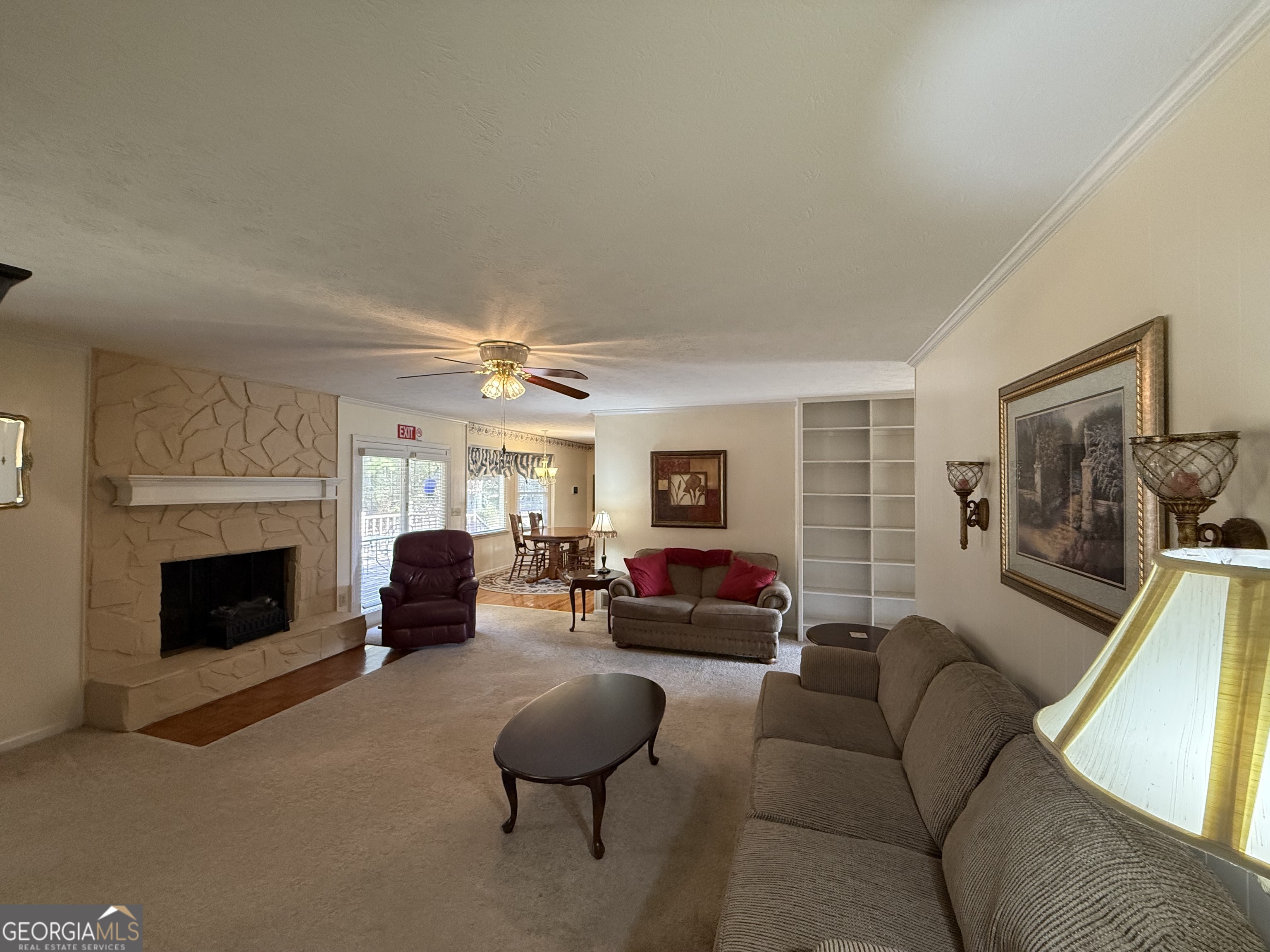 1084 Macedonia Road Newnan, GA 30263 - Photo 10 of 24 a living room with furniture and a fireplace