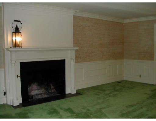 14 Mason Road Newton, MA 02459 - Photo 4 of 5 a view of an empty room with window and fire place