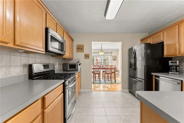 a view of a livingroom with furniture and a window