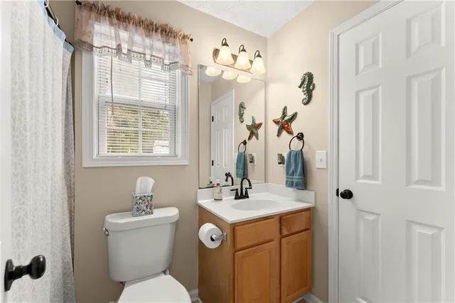 a bedroom with a bed and a chair