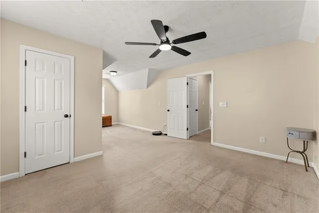 a work room with furniture and a large window