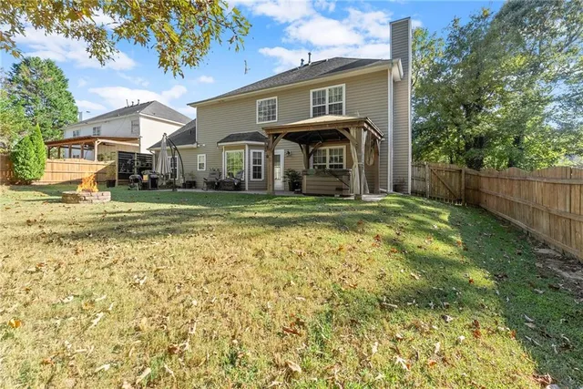 a view of a city with lush green forest