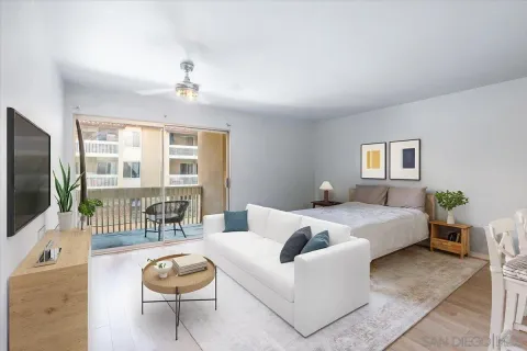 a spacious bedroom with a bed and glass door