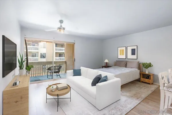 a spacious bedroom with a bed and glass door