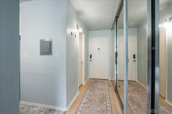 a view of hallway with bathroom