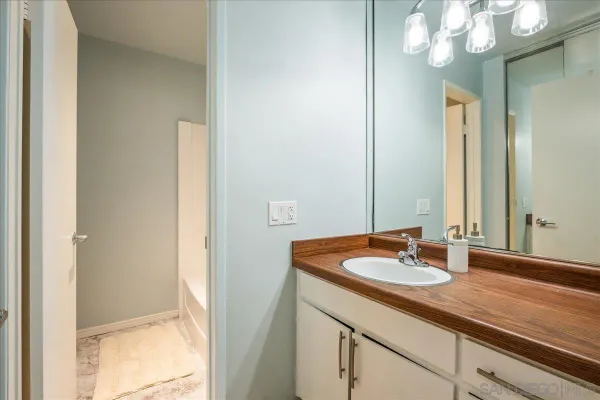 a bathroom with a sink and a mirror