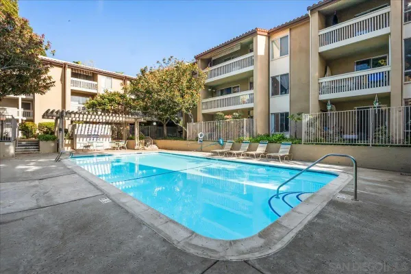 a view of a swimming pool with a lounge chairs