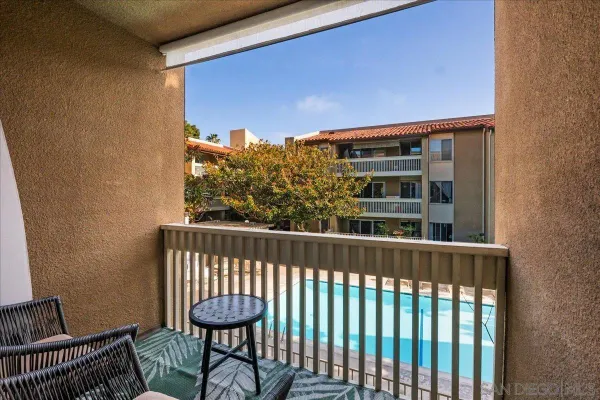 a view of a balcony with furniture