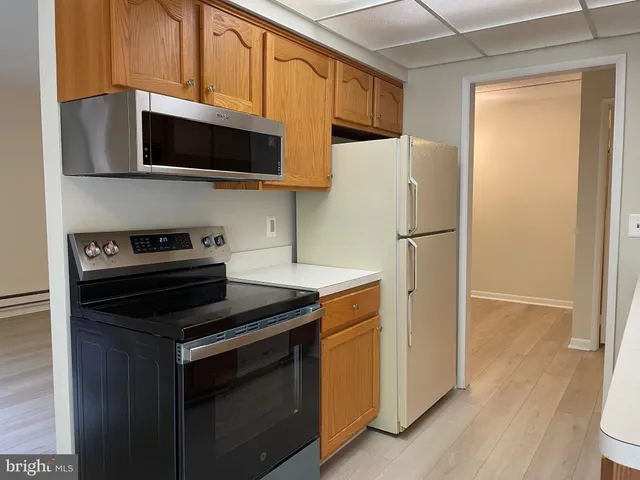 a kitchen with a microwave a stove and a microwave