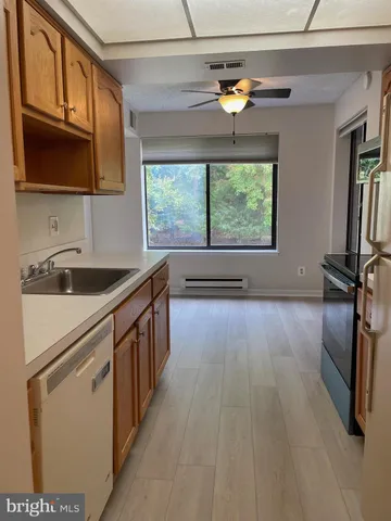 a kitchen with a sink stove and microwave