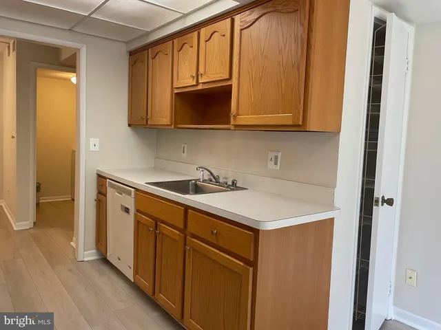 a utility room with cabinets washer and dryer