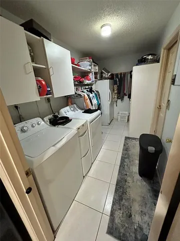 a storage room with washer and dryer
