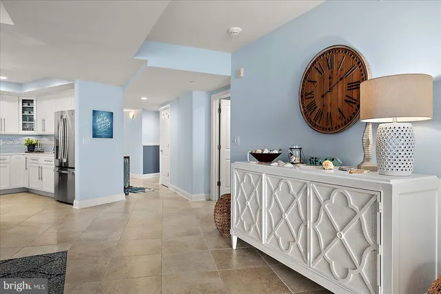 a kitchen with cabinets and stainless steel appliances