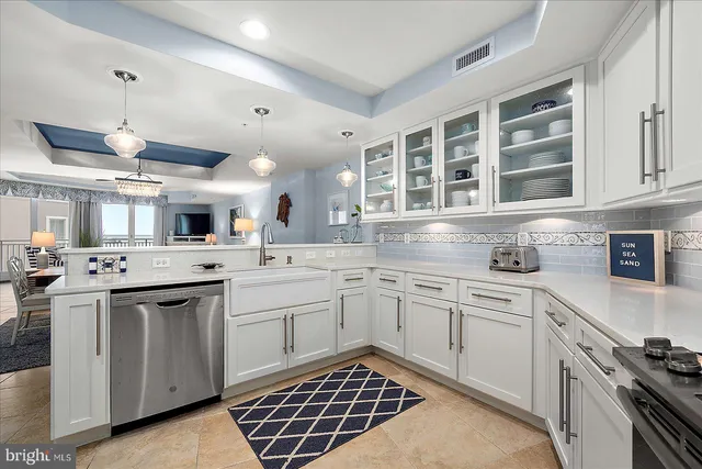 a bed room with bed and a chandelier