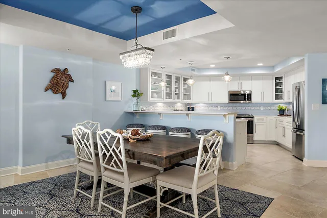 a spacious bathroom with a shower a sink and a mirror