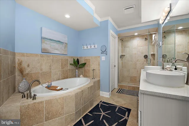 a bedroom with bed and wooden floor