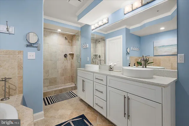 a spacious bedroom with a large bed and a flat screen tv